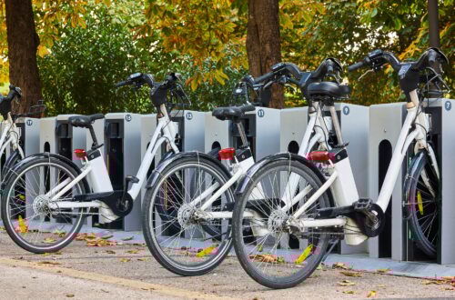 Urban electric bikes charging batteries in the city. Transportation