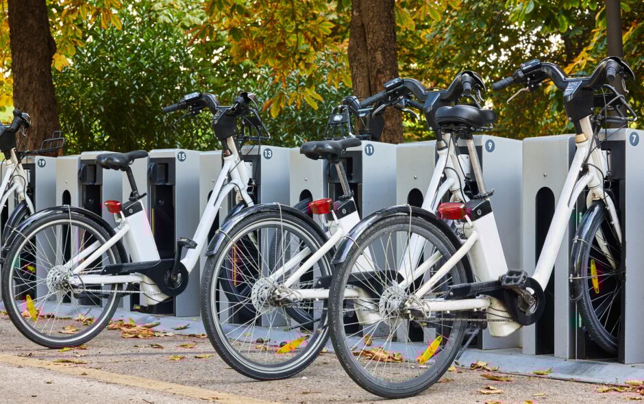Urban electric bikes charging batteries in the city. Transportation